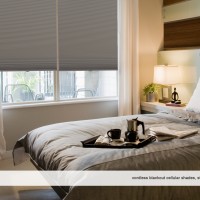 Wood and Glass Panels on Wall Behind Bed